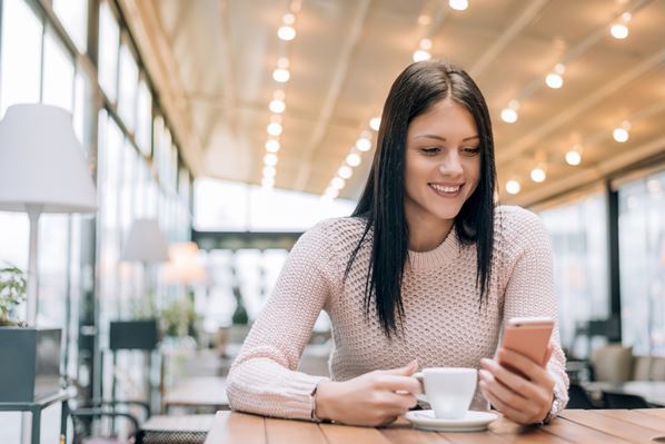 women looking at her mobile phone